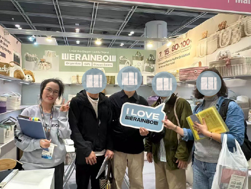 WERAINBOW team with trade show visitors
